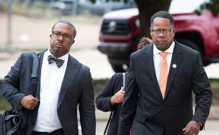 Former Jackson city councilman Aaron Banks, right, arrives at the federal courthouse alongside his attorney.
