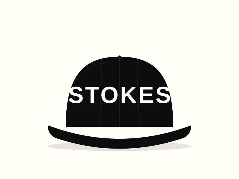 Black structured baseball cap with white embroidered STOKES lettering.